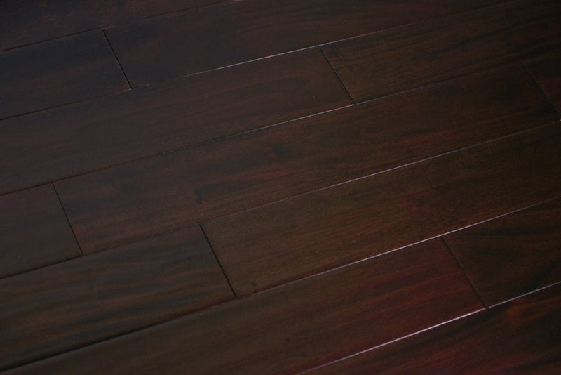 "Indo Mahogany Distressed/Handscraped Solid Hardwood Flooring in a Dark Ebony finish, 3/4 x 5 inches. SKU: TRPSH-IMDE. Revel in the luxurious depth and character of this exquisite flooring choice, adding elegance to any space."