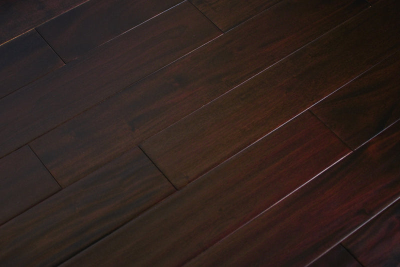 "Indo Mahogany Distressed/Handscraped Solid Hardwood Flooring in a Dark Ebony finish, 3/4 x 5 inches. SKU: TRPSH-IMDE. Revel in the luxurious depth and character of this exquisite flooring choice, adding elegance to any space."