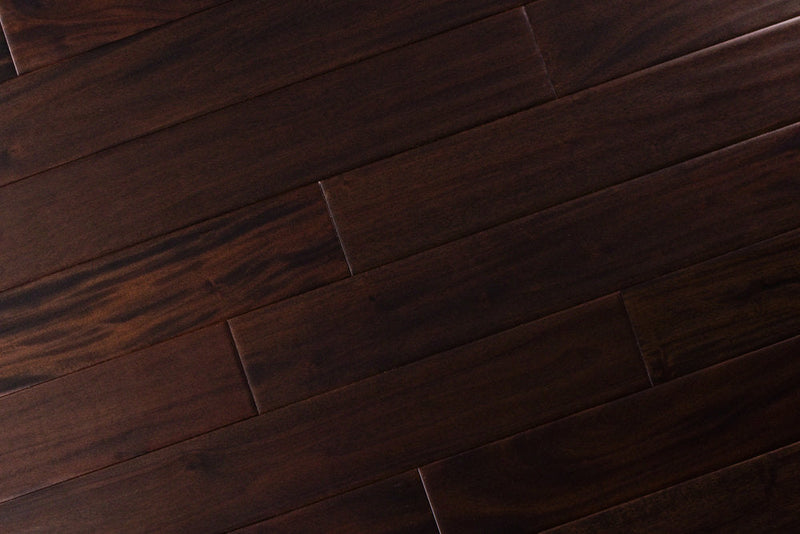 "Indo Mahogany Distressed/Handscraped Solid Hardwood Flooring in a Dark Ebony finish, 3/4 x 5 inches. SKU: TRPSH-IMDE. Revel in the luxurious depth and character of this exquisite flooring choice, adding elegance to any space."