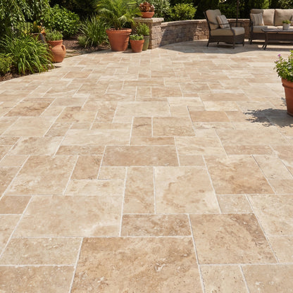 Paved patio with stone tiles, outdoor furniture, and plants in a garden setting.