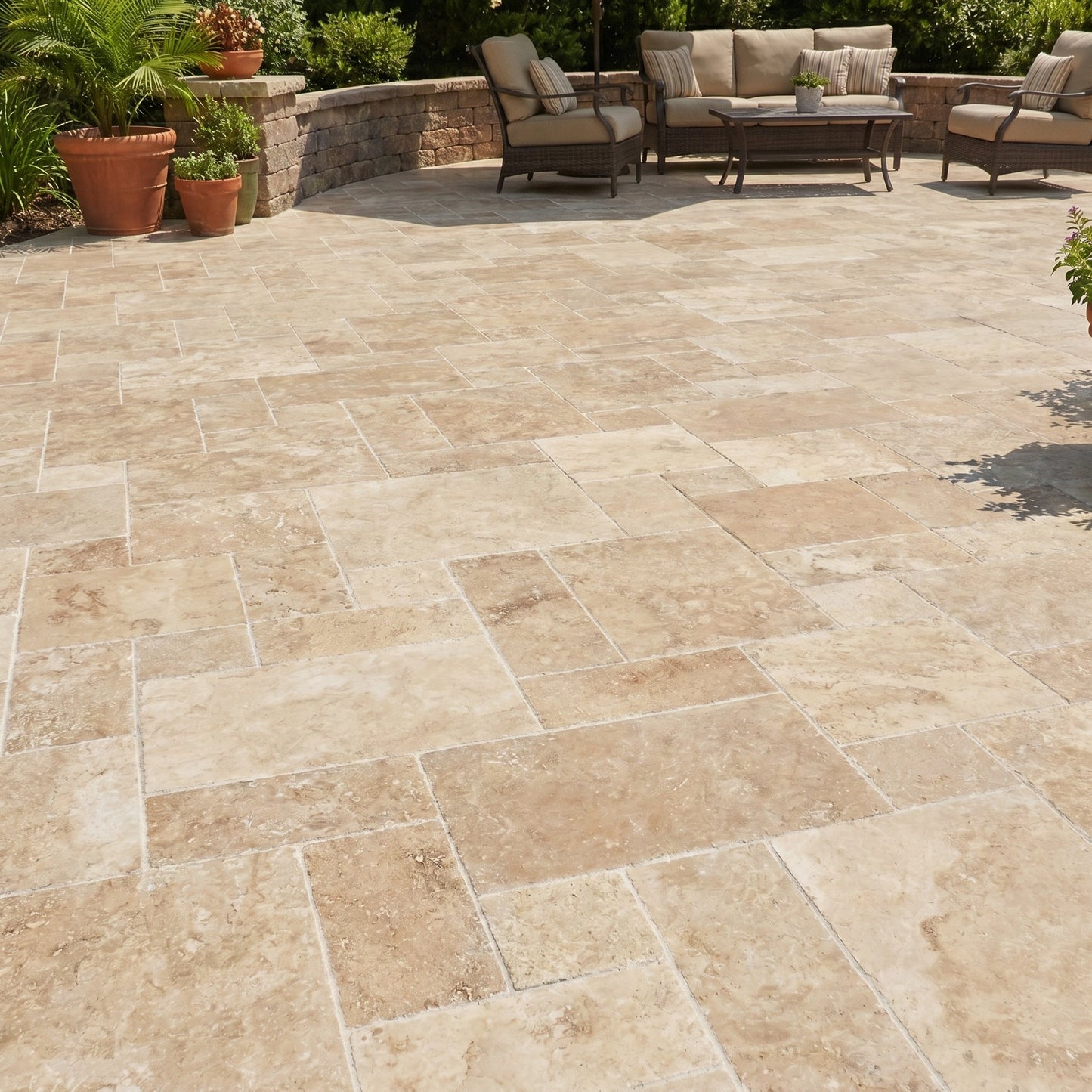 Outdoor patio with stone tiles, furniture, and plants