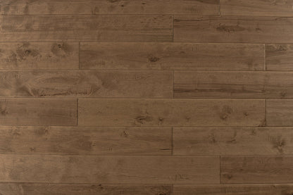 "High-quality Maple Distressed/Handscraped Solid Hardwood Flooring in a Natural Toast finish. Each plank measures 3/4 x 5 inches. SKU: TRPSH-MPNT. Enhance your space with its warm tones and exquisite texture."