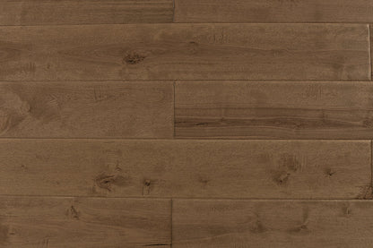 "High-quality Maple Distressed/Handscraped Solid Hardwood Flooring in a Natural Toast finish. Each plank measures 3/4 x 5 inches. SKU: TRPSH-MPNT. Enhance your space with its warm tones and exquisite texture."