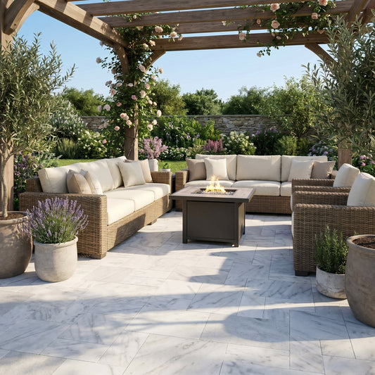 Outdoor patio with wicker furniture, fire pit, and floral decorations. Turkish Carrara White Marble Sand-Blasted Pavers