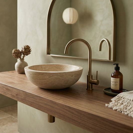Bathroom vanity with stone sink, bronze faucet, and decorative items. Beige Travertine Natural Stone Vessel Sink Honed and Filled  (D)16" (H)6"