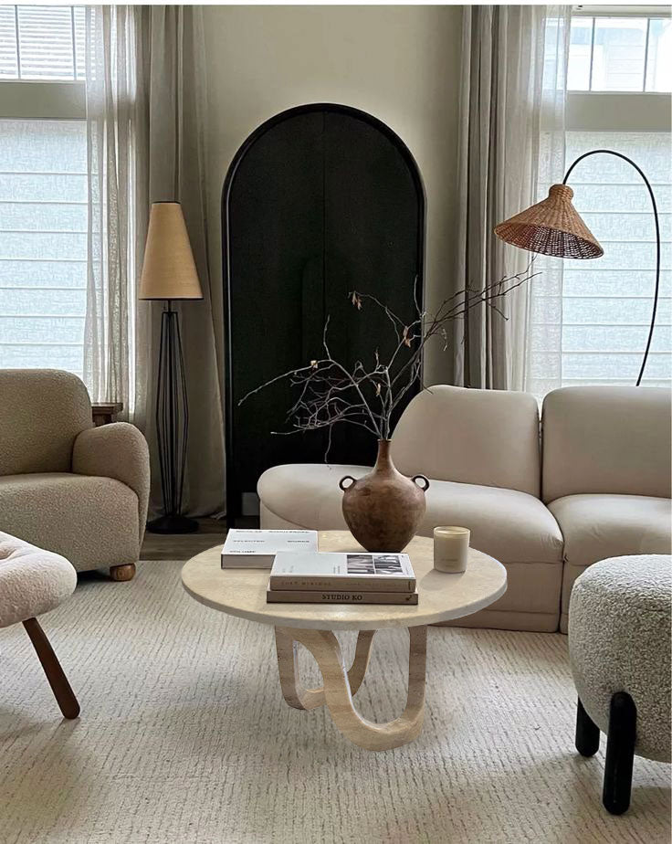 Troia Light Travertine Vein-cut Designer Round Polished Coffee Table (D)24" (H)14" living room beige couch and beige carpet wide view