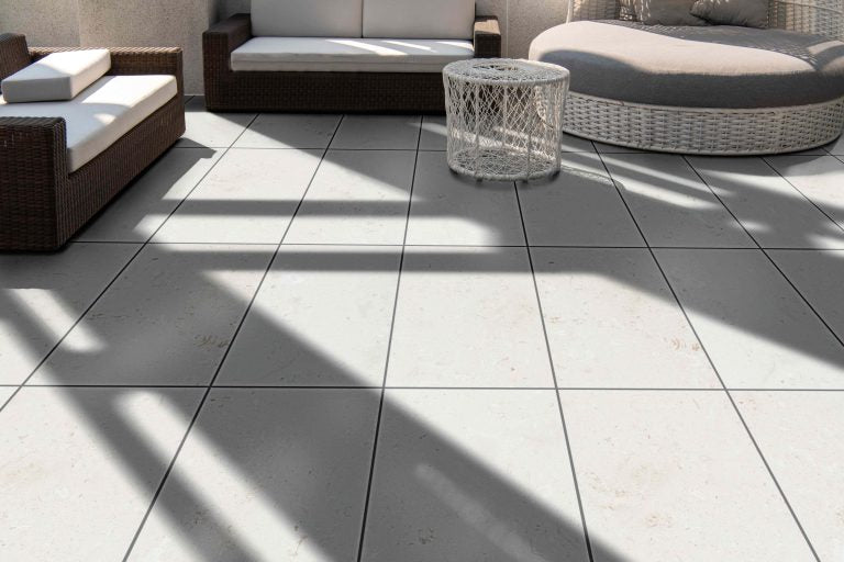 myra white limestone tile installed in garden