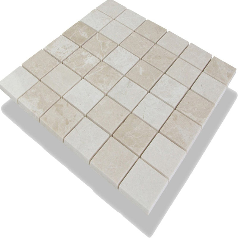 Crema marfil beige marble mosaic 2"x2" polished SKU-10083731 angle view of mesh 