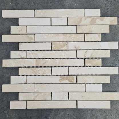 Shell Stone Limestone Strip Liner on 12" x 12" Mesh Mosaic Tile SKU-HSSSSLNBMOSH under sunlight