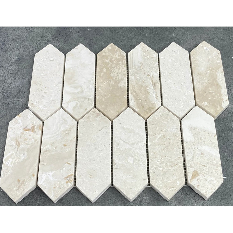 Shell Stone Limestone Strada Design on 12" x 12" Mesh Mosaic Tile SKU-HSSSSTRDMOSH under sunlight