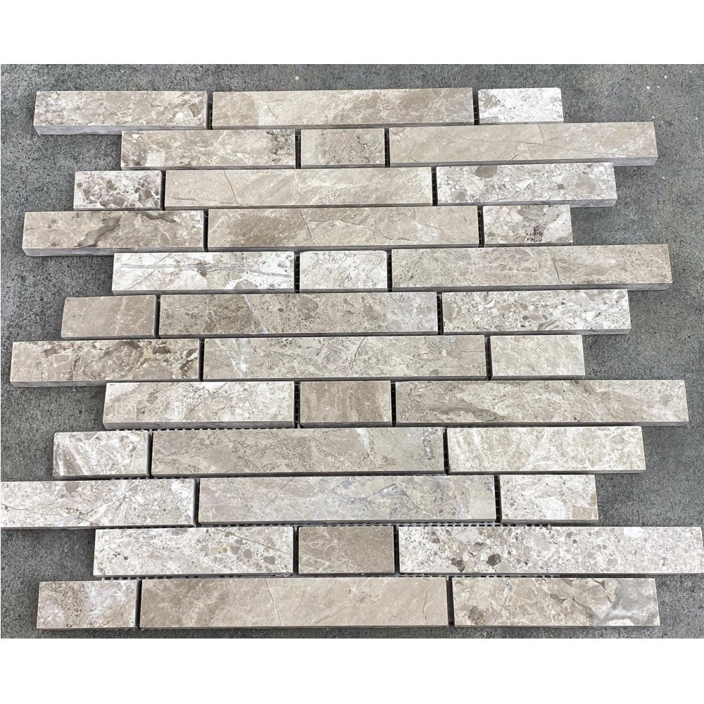 Silver Shadow Marble Liner on 12" x 12" Mesh Mosaic Tile SKU-HSHSSLNBMOSH under sunlight