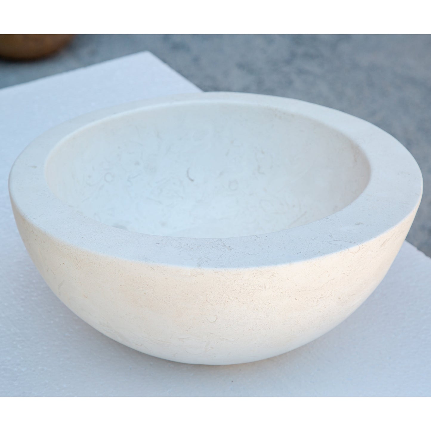 White limestone sloped rim circular vessel sink NRSTC07 D16 angle view