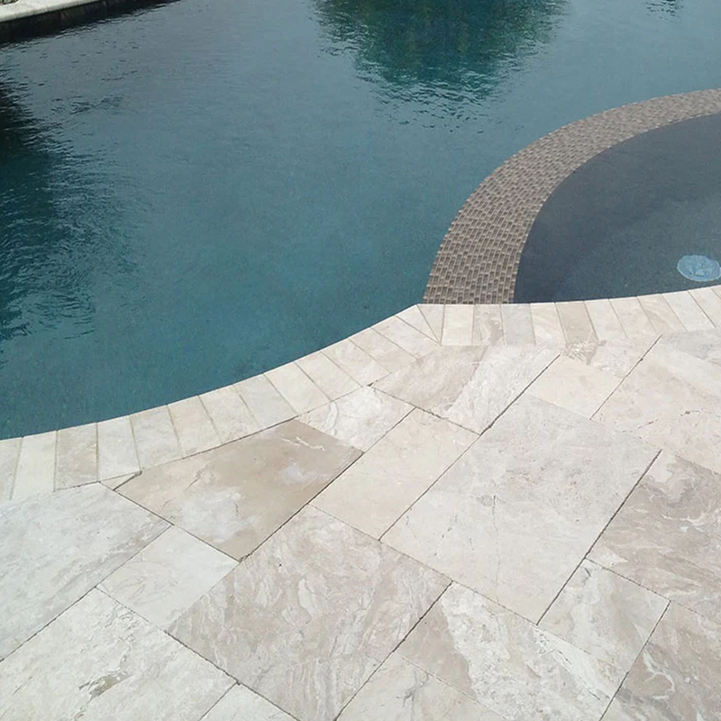 Diana Royal Beige Marble Versailles Pattern Floor and Wall Tile SKU-317326 installed around pool